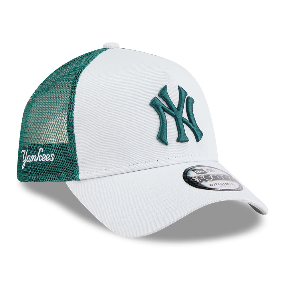 White and green baseball cap with 'Yankees' logo on a white background