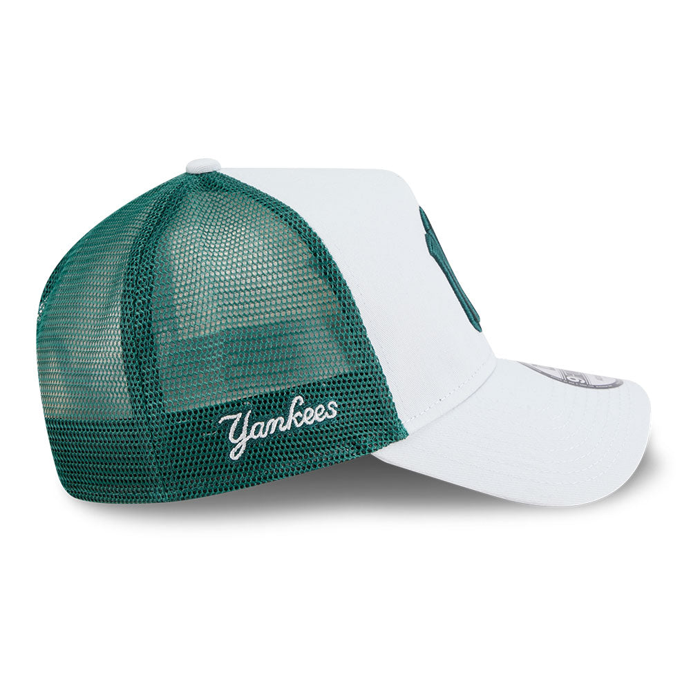 Green and white cap with 'Yankees' logo on a white background