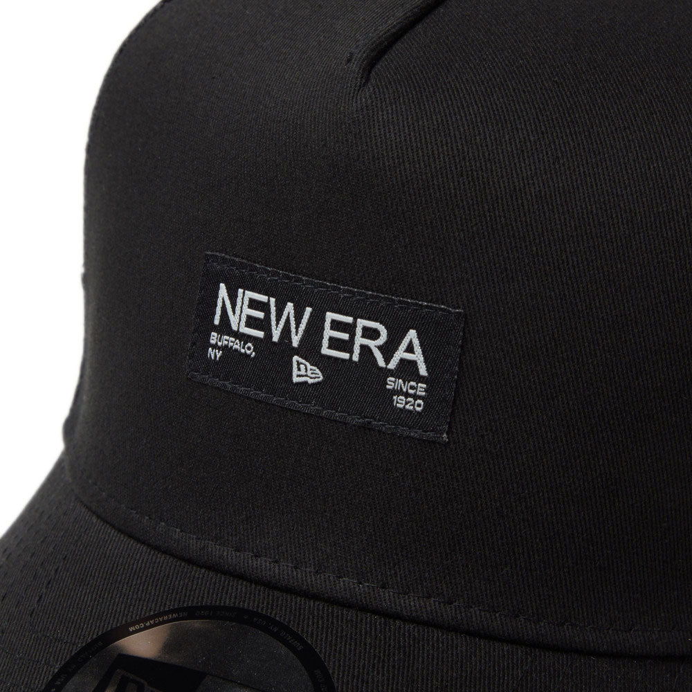 New Era Silver Wordmark Metal Flag Black 9FORTY A-Frame Trucker Snapback Cap