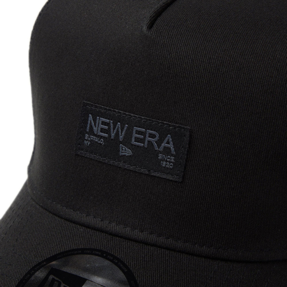 New Era Black Wordmark Metal Flag Black 9FORTY A-Frame Trucker Snapback Cap