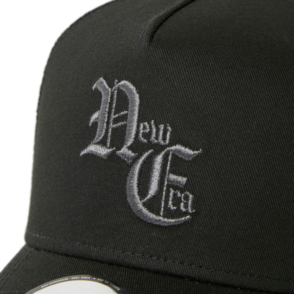 New Era NE Old English Logo Black White 9FORTY A-Frame Trucker Snapback Cap